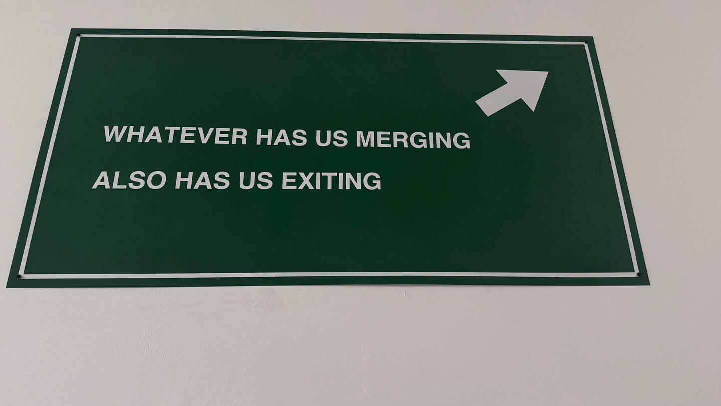 FREEWAY SIGN : Whatever has us merging also has us exiting